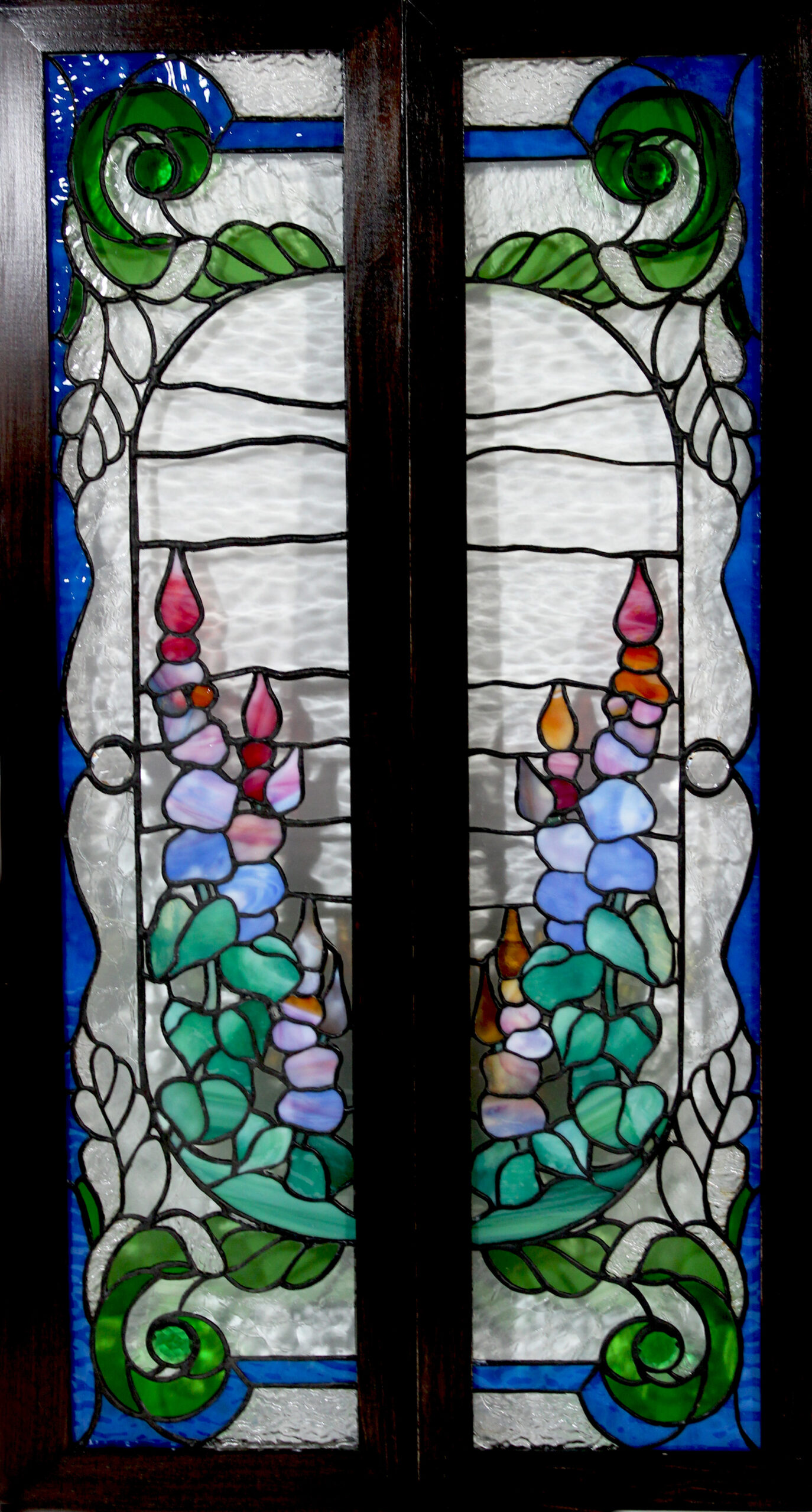 Sidelights is a copper-foil stained glass pair of windows for installation or hanging separately (they are individually framed)